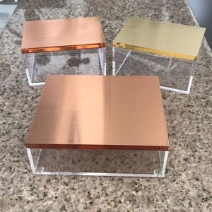 Three acrylic storage boxes